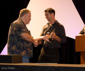 Dr. Matt Wittenrich, right, being handed the award by MASNA President, Steve Allen, left.